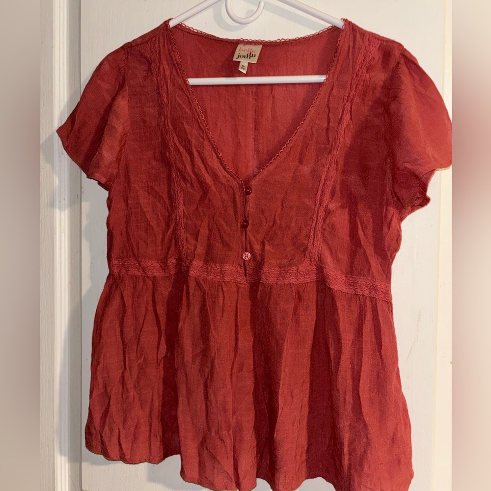 Light fabric salmon colored babydoll top .